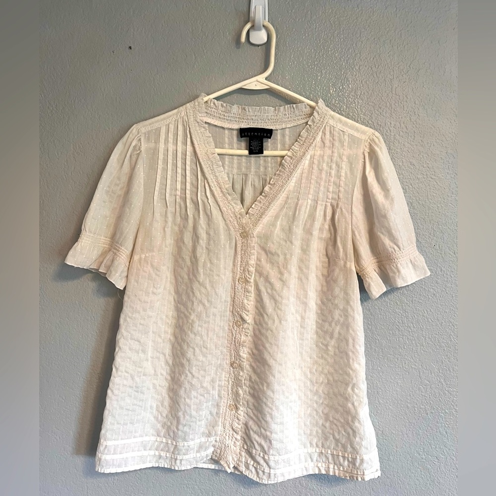 Attention button down top.